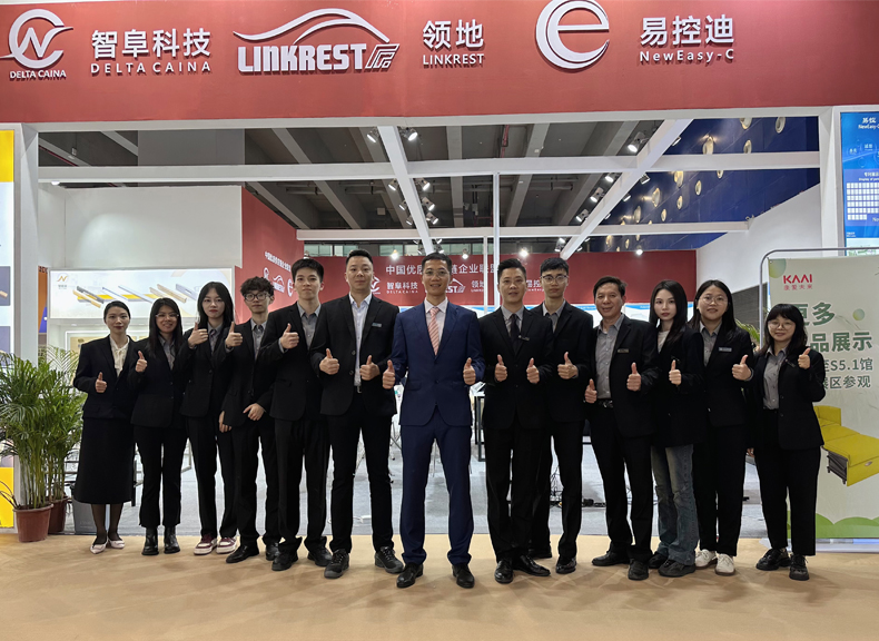Group photo at a trade exhibition, showcasing DELTA CAINA's team and global presence as a trusted provider of furniture hardware solutions.